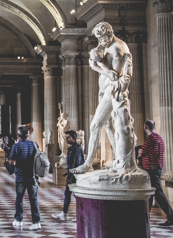 Patrons within a museum with various sculptures