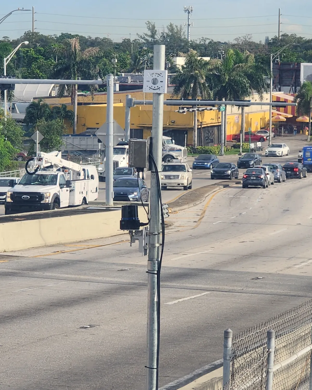 Quanergy Q-TRACK LR 3D LiDAR sensor mounted on a pole at a movable bridge with traffic on the approach