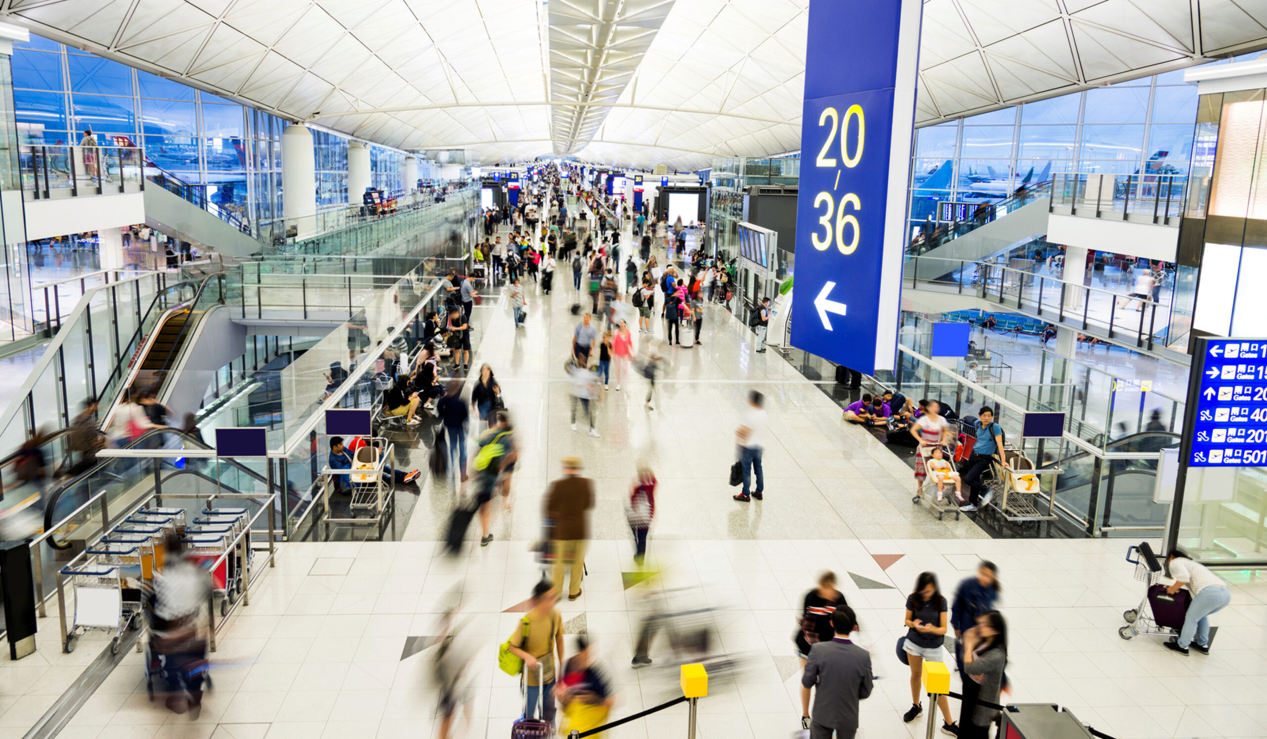 Passengers moving through an airport terminal