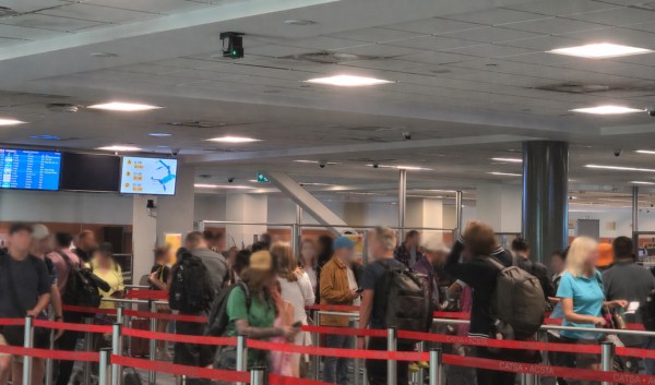 Travelers at Vancouver airport with faces blurred, representing privacy-safe people counting using 3D LiDAR